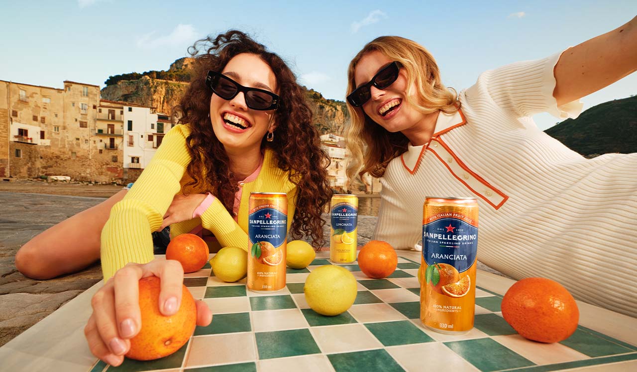 two girls playing chess with cans