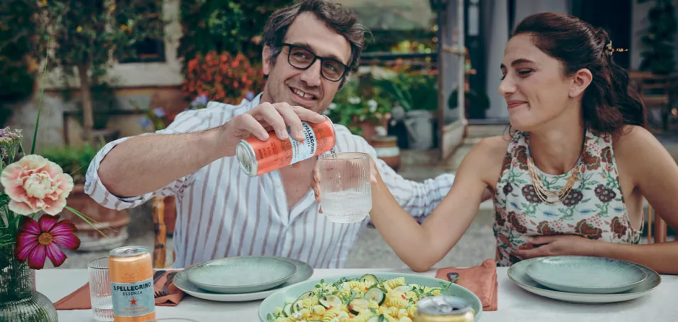 Guy pourung S.Pellegrino Essenza Blood Orange flavour