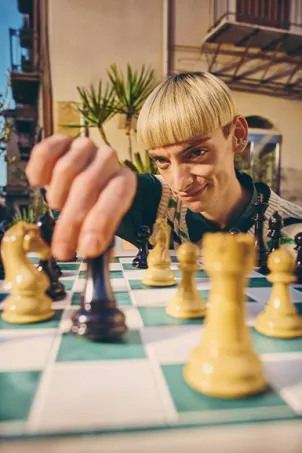 guy playing chess with oranges